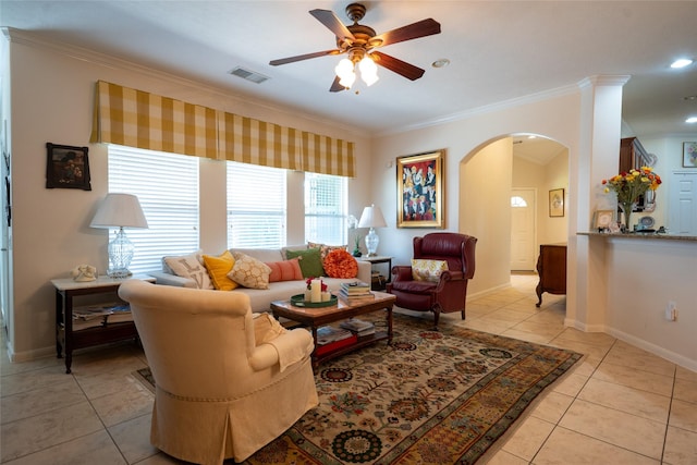 25230 Aspenlodge Ln, Katy, TX 77494 - living area featuring arched walkways, crown molding, ceiling fan, light tile patterned floors, and baseboards