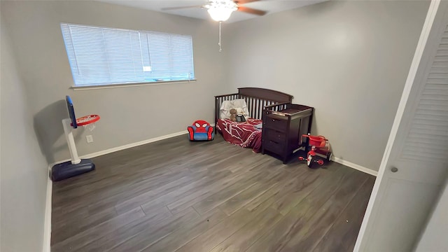 2263 Triway Ln, Houston, TX 77043 - unfurnished bedroom featuring wood finished floors, baseboards, and a ceiling fan
