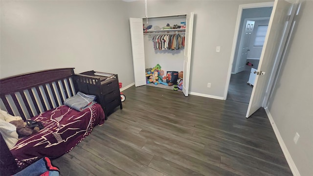 2263 Triway Ln, Houston, TX 77043 - bedroom with wood finished floors, baseboards, and a closet