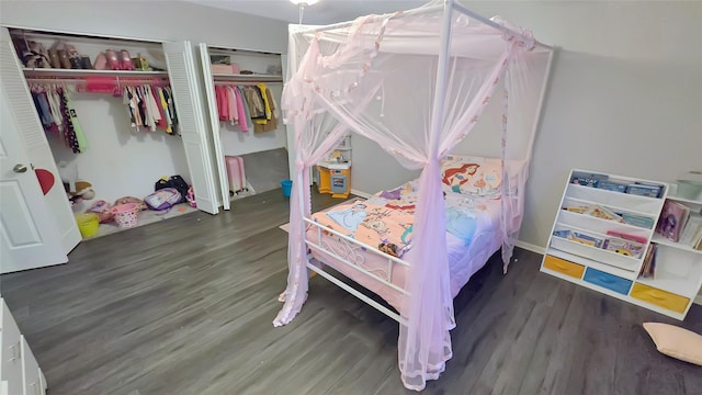 2263 Triway Ln, Houston, TX 77043 - bedroom with wood finished floors and multiple closets