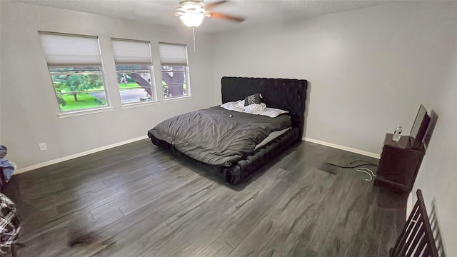 2263 Triway Ln, Houston, TX 77043 - bedroom with wood finished floors, baseboards, a textured ceiling, and ceiling fan
