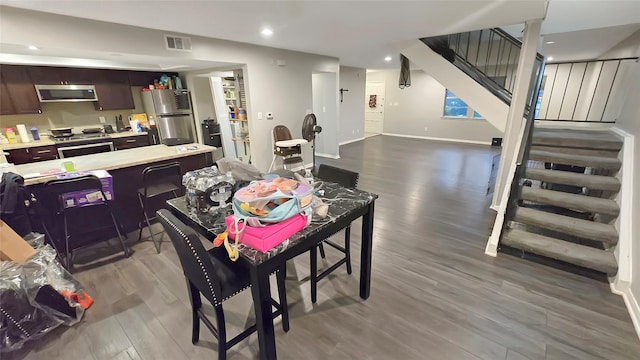 2263 Triway Ln, Houston, TX 77043 - dining room with wood finished floors, stairs, baseboards, and recessed lighting