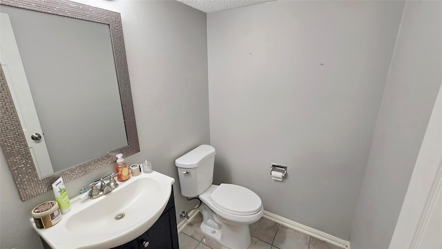 2263 Triway Ln, Houston, TX 77043 - half bathroom with toilet, tile patterned floors, vanity, and baseboards