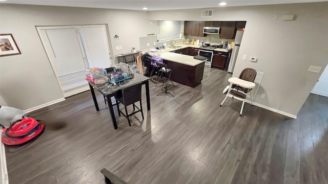 2263 Triway Ln, Houston, TX 77043 - dining room with recessed lighting, dark wood-type flooring, and baseboards