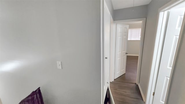 2263 Triway Ln, Houston, TX 77043 - corridor featuring baseboards, wood finished floors, and attic access