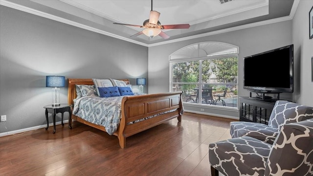 13402 Layton Castle Ln, Cypress, TX 77429 - bedroom with wood finished floors, crown molding, baseboards, and a ceiling fan