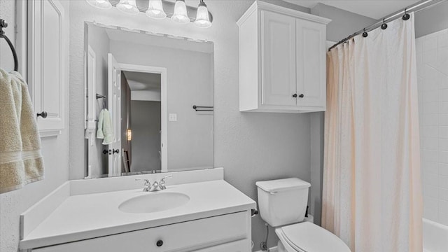 13402 Layton Castle Ln, Cypress, TX 77429 - bathroom featuring toilet, vanity, and shower / tub combo