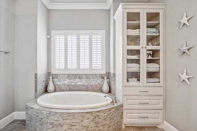32319 Tall Oaks Way, Magnolia, TX 77354 - bathroom featuring a garden tub, baseboards, and ornamental molding