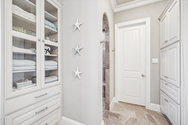 32319 Tall Oaks Way, Magnolia, TX 77354 - bathroom featuring crown molding, baseboards, and a tile shower