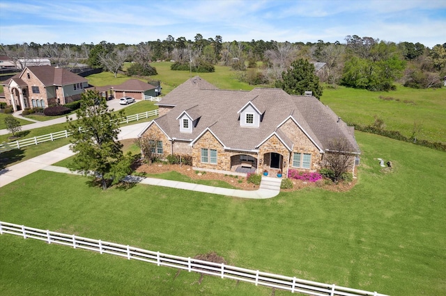 32319 Tall Oaks Way, Magnolia, TX 77354 - view of front of home featuring stone siding and view of scattered trees