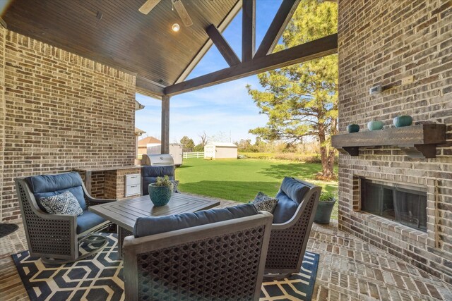 32319 Tall Oaks Way, Magnolia, TX 77354 - view of patio / terrace with an outdoor brick fireplace, area for grilling, and a ceiling fan