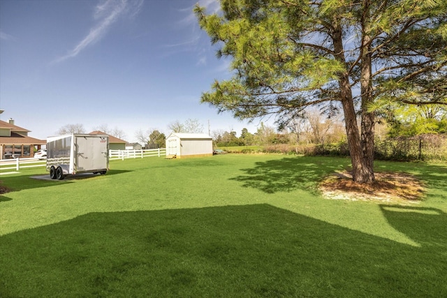 32319 Tall Oaks Way, Magnolia, TX 77354 - view of yard featuring a shed and an outdoor structure