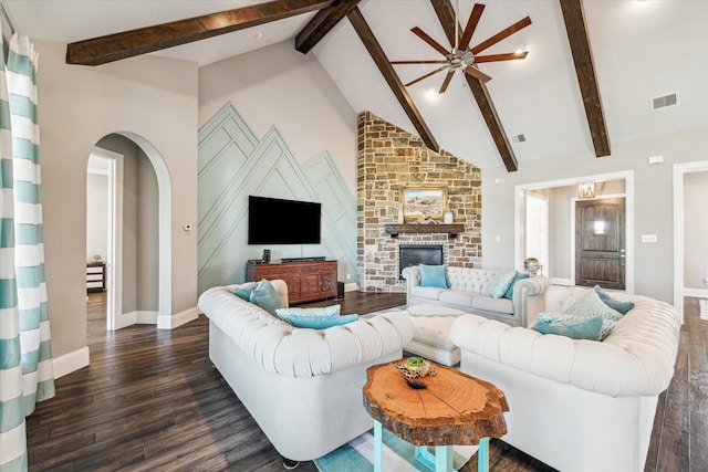 32319 Tall Oaks Way, Magnolia, TX 77354 - living room with a ceiling fan, dark wood finished floors, arched walkways, beamed ceiling, and baseboards