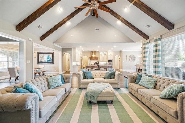32319 Tall Oaks Way, Magnolia, TX 77354 - living area with arched walkways, high vaulted ceiling, recessed lighting, ceiling fan, and beamed ceiling