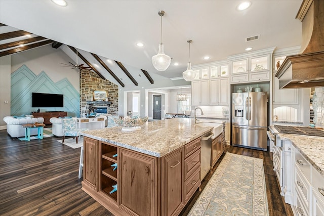32319 Tall Oaks Way, Magnolia, TX 77354 - kitchen featuring appliances with stainless steel finishes, a sink, tasteful backsplash, dark wood-style flooring, and open floor plan