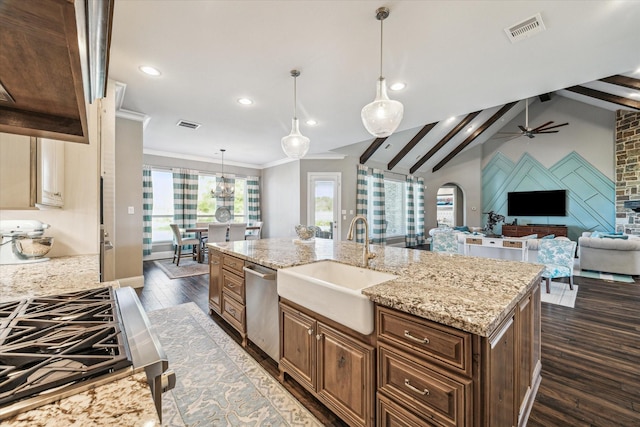 32319 Tall Oaks Way, Magnolia, TX 77354 - kitchen with a sink, recessed lighting, dark wood-style flooring, open floor plan, and arched walkways