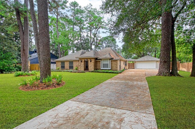 6214 Oak Masters Dr, Spring, TX 77379 - single story home with driveway, a garage, and brick siding