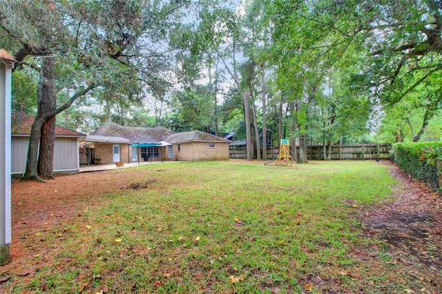 6214 Oak Masters Dr, Spring, TX 77379 - view of yard with a playground and a patio area