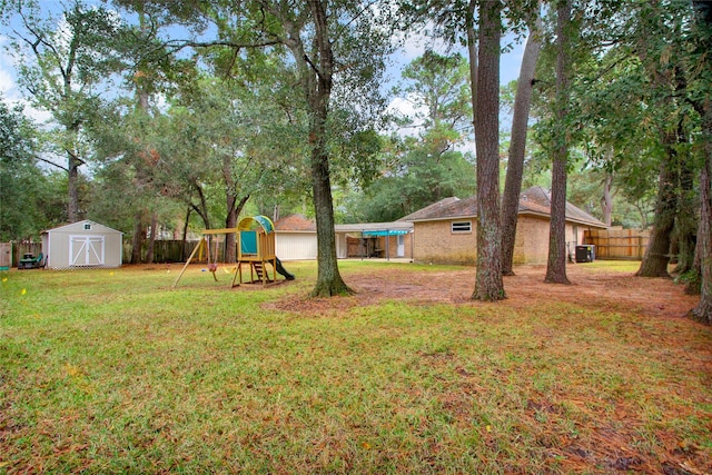 6214 Oak Masters Dr, Spring, TX 77379 - view of yard with a storage unit, a playground, and an outdoor structure