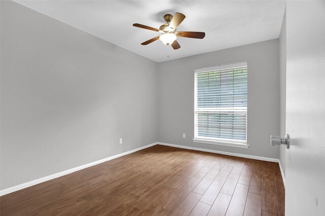 6214 Oak Masters Dr, Spring, TX 77379 - unfurnished room featuring baseboards, a ceiling fan, and wood finished floors