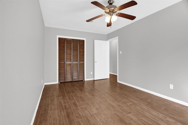6214 Oak Masters Dr, Spring, TX 77379 - unfurnished bedroom with wood finished floors, a closet, and baseboards