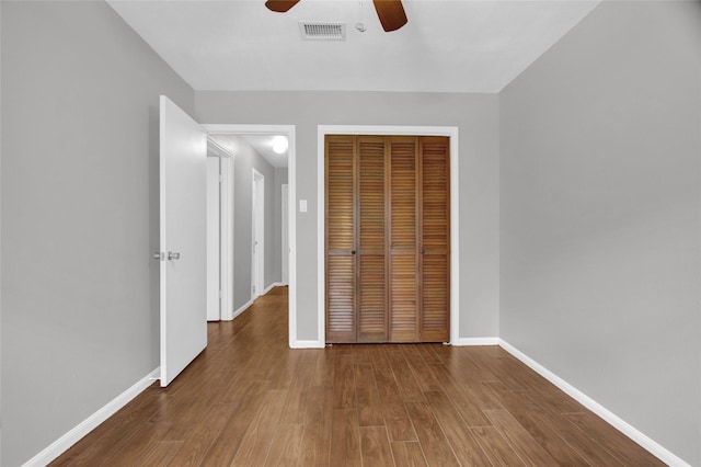 6214 Oak Masters Dr, Spring, TX 77379 - unfurnished bedroom with a closet, wood finished floors, baseboards, and a ceiling fan