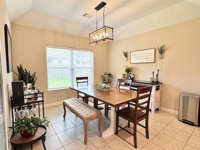 969 Gowan Dr, Conroe, TX 77301 - dining space with a chandelier, light tile patterned flooring, and baseboards