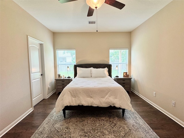 969 Gowan Dr, Conroe, TX 77301 - bedroom with dark wood-type flooring and baseboards