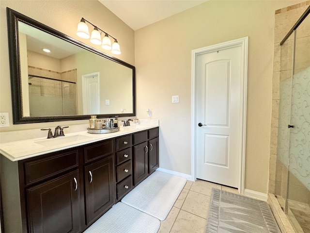 969 Gowan Dr, Conroe, TX 77301 - bathroom with a stall shower, tile patterned flooring, double vanity, and baseboards