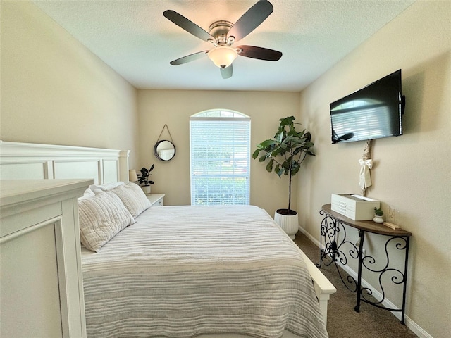 969 Gowan Dr, Conroe, TX 77301 - bedroom with carpet flooring, a ceiling fan, and a textured ceiling