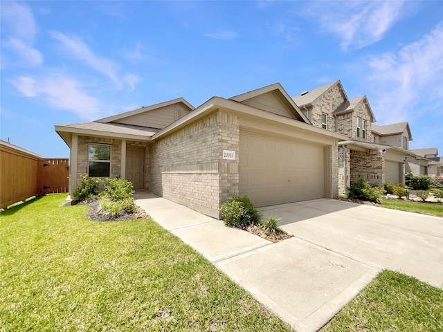 20011 Epirus Shores Dr, Hockley, TX 77447 - view of front of property with an attached garage, concrete driveway, brick siding, and stone siding