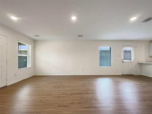 20011 Epirus Shores Dr, Hockley, TX 77447 - unfurnished room featuring wood finished floors, recessed lighting, and baseboards