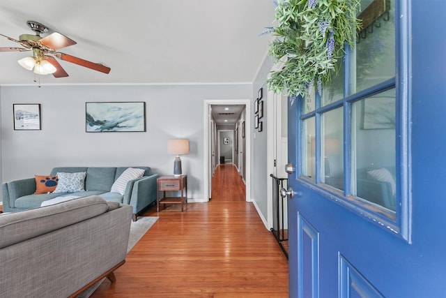 10438 Brinwood Dr, Houston, TX 77043 - entryway with light wood-style flooring, ceiling fan, and baseboards