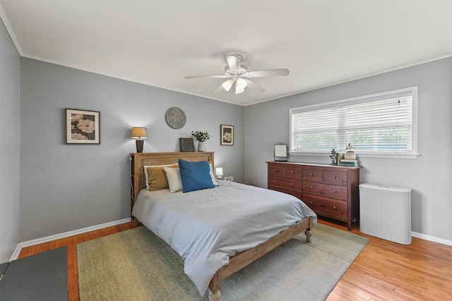 10438 Brinwood Dr, Houston, TX 77043 - bedroom featuring light wood finished floors, baseboards, crown molding, and ceiling fan
