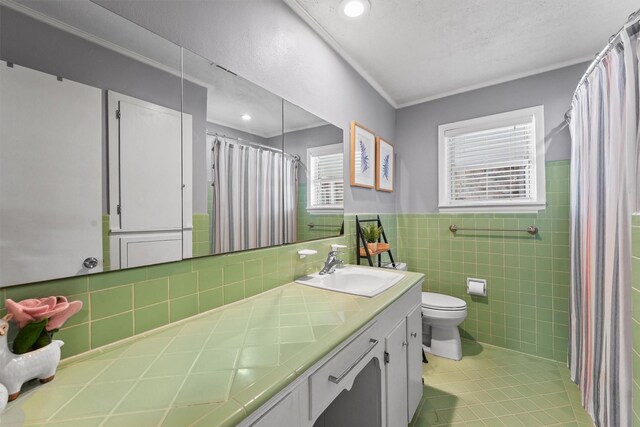 10438 Brinwood Dr, Houston, TX 77043 - bathroom with toilet, tile walls, vanity, a shower with curtain, and tile patterned flooring