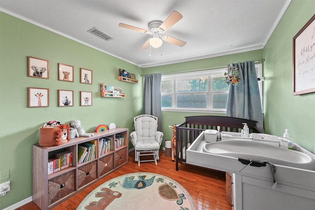 10438 Brinwood Dr, Houston, TX 77043 - bedroom featuring crown molding, wood finished floors, ceiling fan, and baseboards