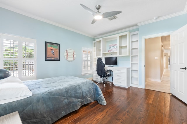 bedroom with crown molding, a desk, dark wood-type flooring, baseboards, and a ceiling fan