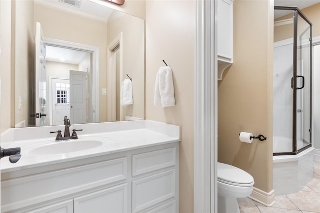 full bath with a shower stall, tile patterned floors, toilet, and vanity