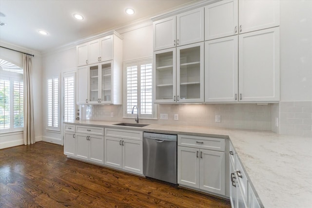 1206 Lake Pointe Pkwy, Sugar Land, TX 77478 - kitchen featuring dishwasher, a sink, white cabinets, dark wood finished floors, and backsplash