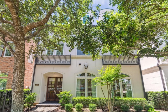 1206 Lake Pointe Pkwy, Sugar Land, TX 77478 - entrance to property featuring a balcony, stucco siding, and french doors