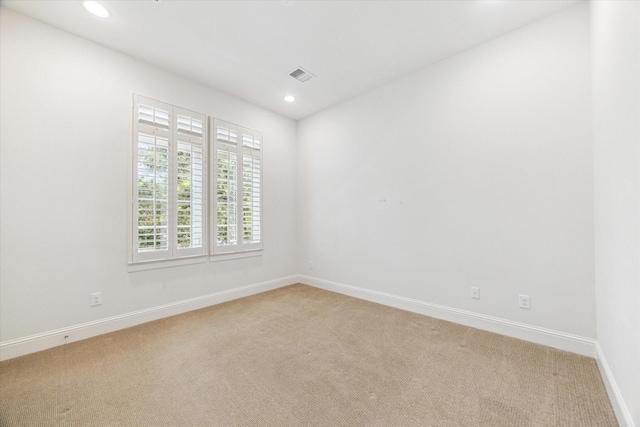 1206 Lake Pointe Pkwy, Sugar Land, TX 77478 - empty room featuring light colored carpet, baseboards, and recessed lighting
