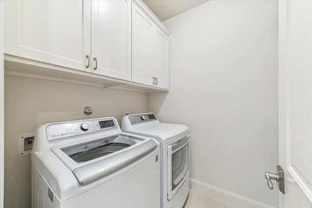 1206 Lake Pointe Pkwy, Sugar Land, TX 77478 - washroom with cabinet space, washer and dryer, and baseboards