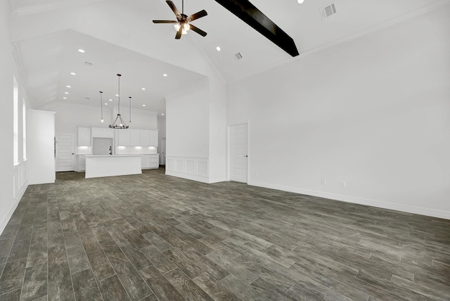 400 Little Spring Ct, Anahuac, TX 77514 - unfurnished living room with high vaulted ceiling, dark wood-style flooring, a ceiling fan, recessed lighting, and a decorative wall