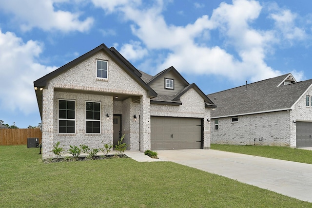 400 Little Spring Ct, Anahuac, TX 77514 - french country inspired facade featuring brick siding, driveway, an attached garage, and a shingled roof