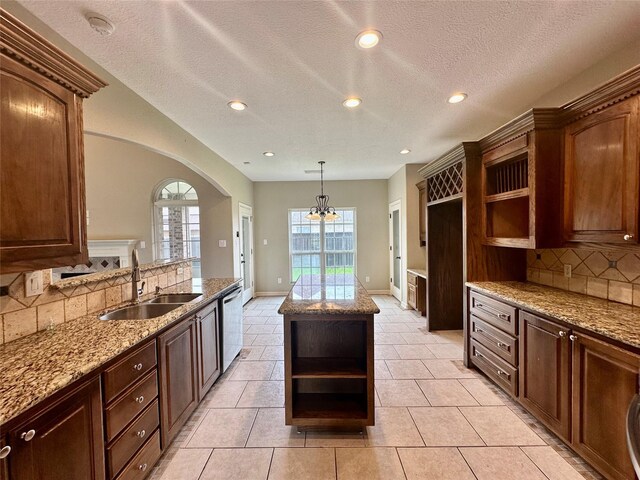 305 Tyler Dr, Bridge City, TX 77630 - kitchen featuring open shelves, a sink, arched walkways, tasteful backsplash, and recessed lighting