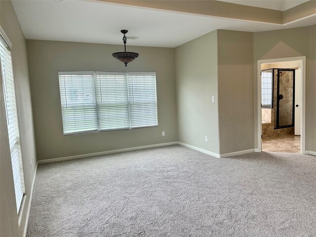 305 Tyler Dr, Bridge City, TX 77630 - carpeted empty room featuring healthy amount of natural light and baseboards