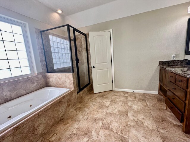 305 Tyler Dr, Bridge City, TX 77630 - full bath featuring plenty of natural light, a shower stall, and a whirlpool tub