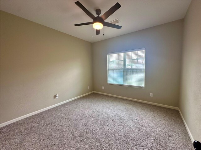 305 Tyler Dr, Bridge City, TX 77630 - carpeted empty room featuring a ceiling fan and baseboards
