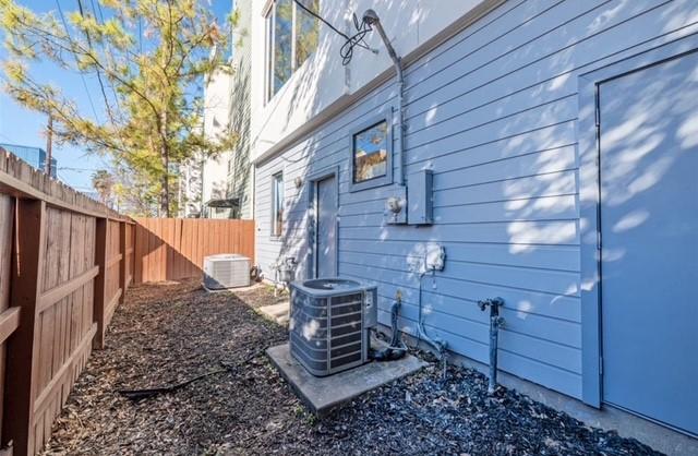 730 Ruthven, Houston, TX 77019 - view of side of property featuring central AC unit and a fenced backyard