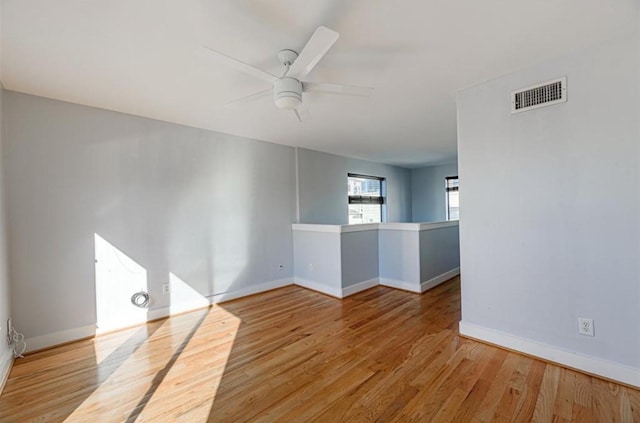 730 Ruthven, Houston, TX 77019 - unfurnished room with a ceiling fan, baseboards, and wood finished floors